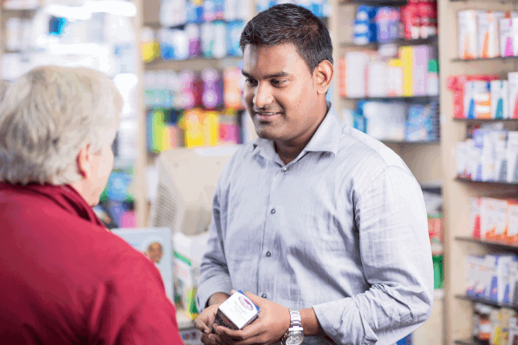 Pharmacist-talking-with-patient-with-Benylin